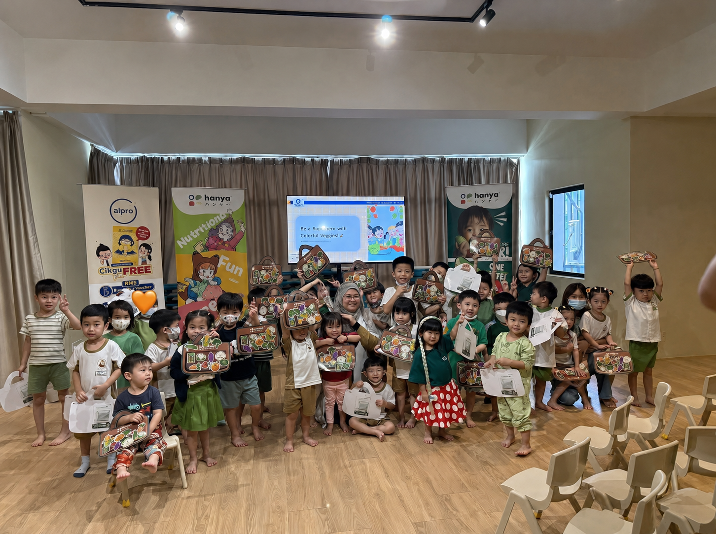 Little Owl children holding activity kits at a group session